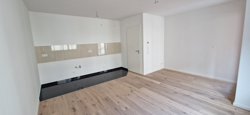 Traumhafte Wohnung im Neubau mit Fußbodenheizung, Parkett und Balkon! - Photo 2